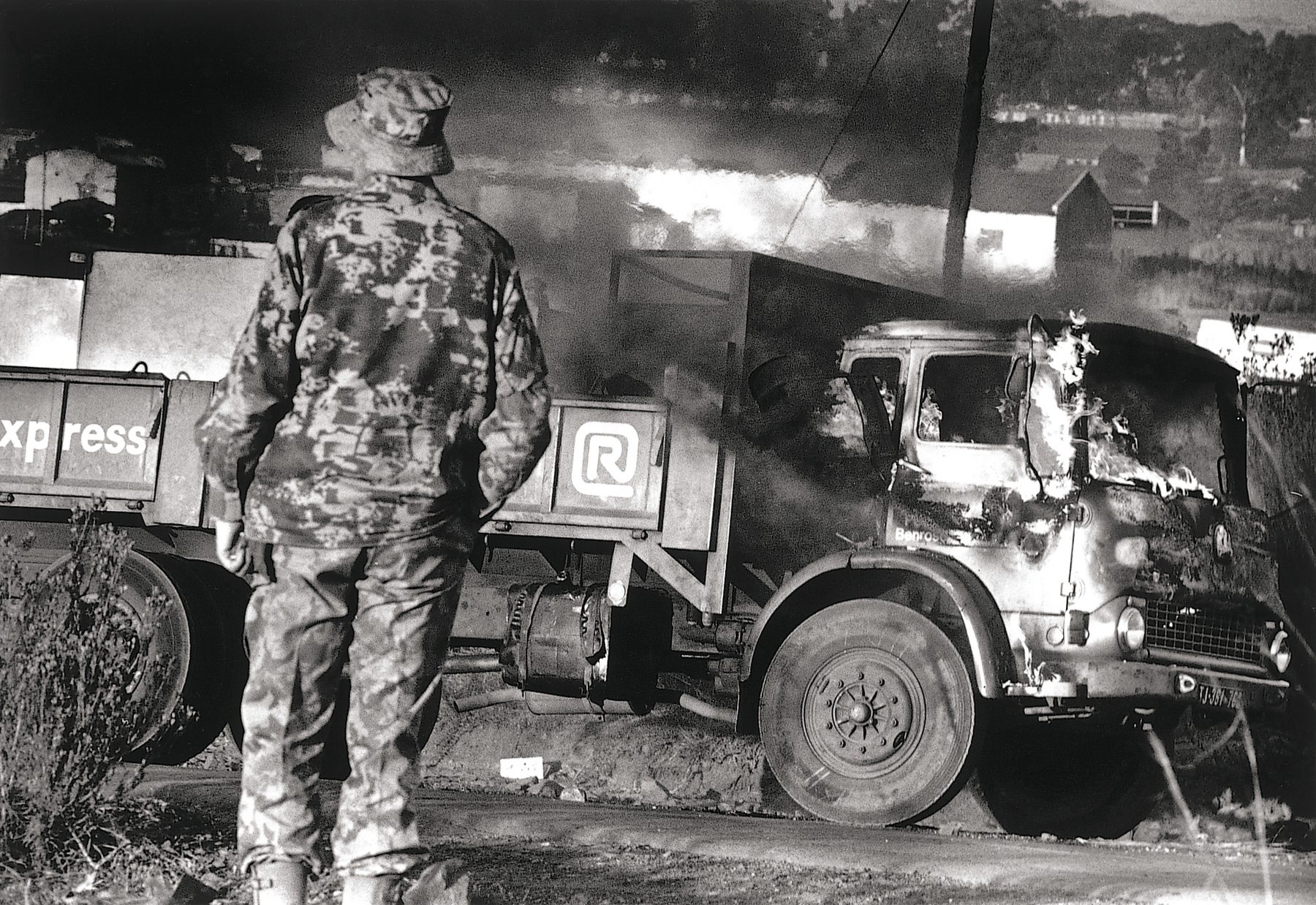 A burning truck next to Moroka Police Station conveys the mood of the era.