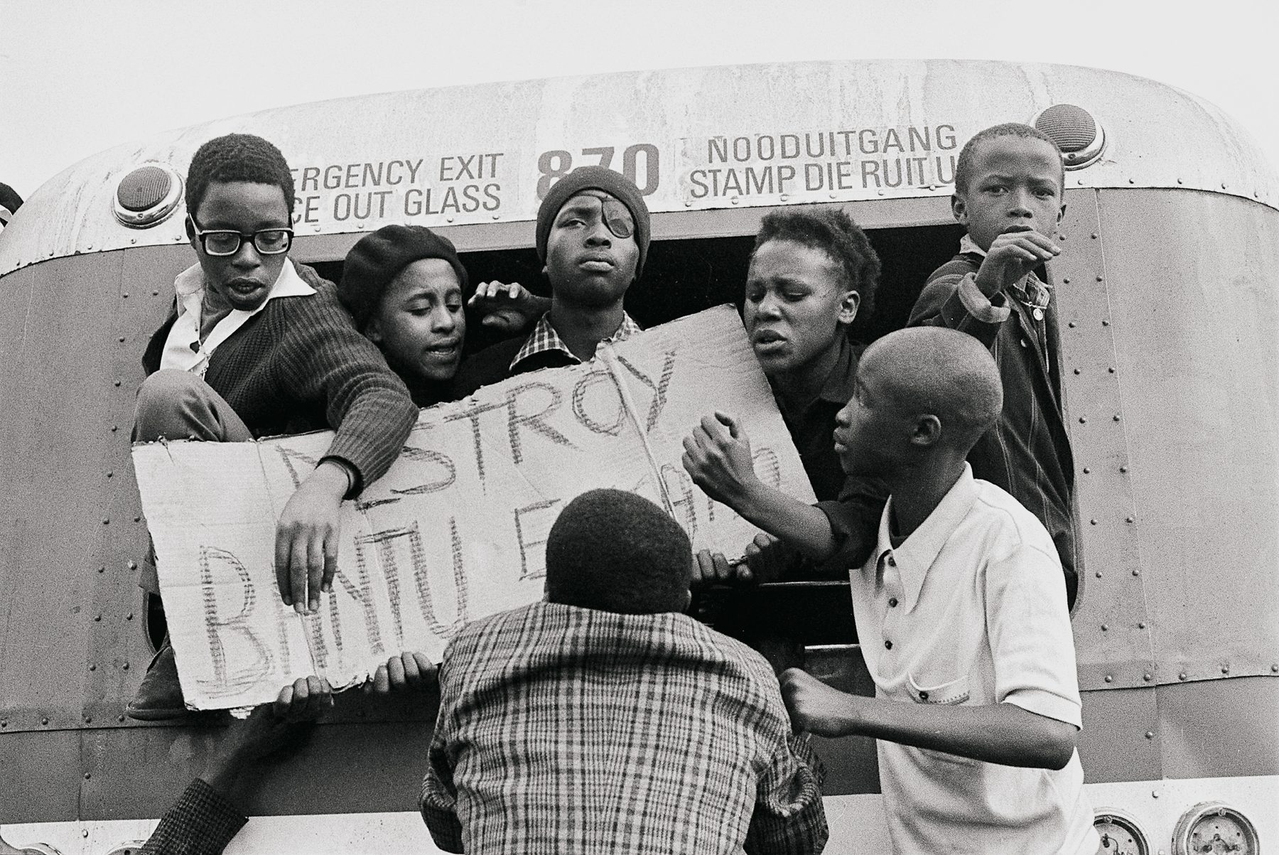Children of Soweto with a placard reading "Destroy Bantu Education".